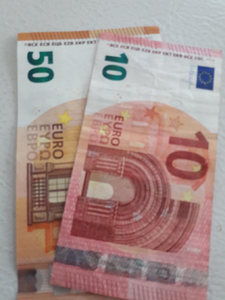 Different euro banknotes and coins